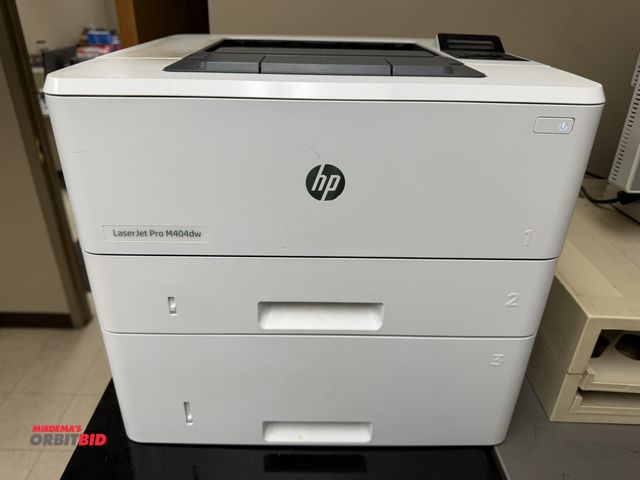 Lot 1-15058 - (1) Hewlett Packard Laser Jet Pro M404DW printer with 2 paper drawers, in working condition.