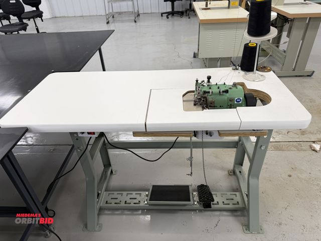 Lot 1-4861 - (1) Merrow, model MG-3DW-2, over seaming sewing machine, S/N 309139, includes power table, foot peda...