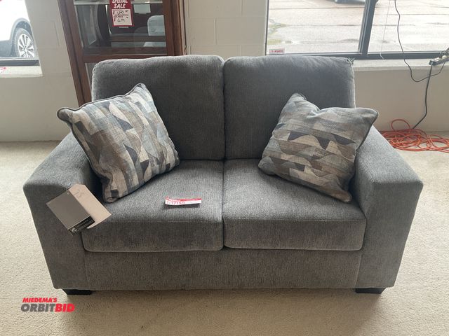 Lot 1-17155 - Signature Design by Ashley loveseat. 62” by 37” deep