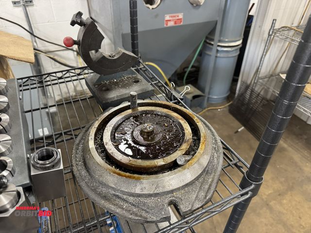 Lot 1-2369 - (1) bench mount Cat 40 tool changer, and turntable for a machinists vise.