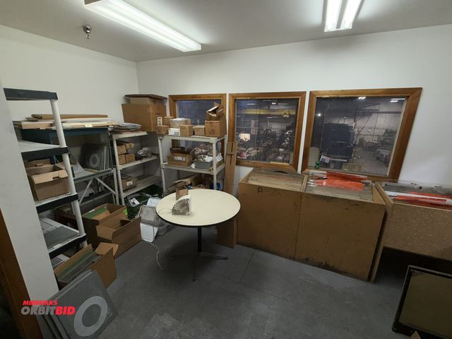 Lot 1-18919 - Contents of office, includes (7) plastic shelving units, full of assorted Howard Miller clock parts,...