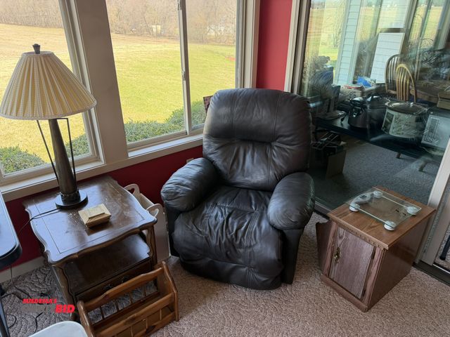 Lot 1-19177 - (1) leather manual reclining chair, (2) wood tables, and (1) wooden magazine rack also include table...