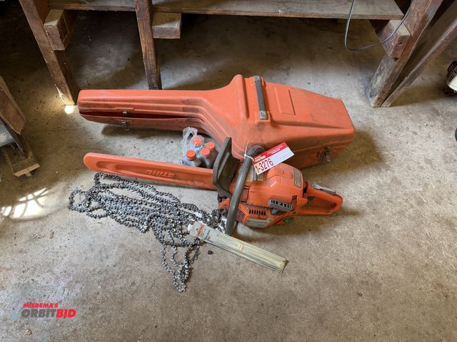 Lot 1-3276 - (1) Husqvarna 353 gas powered chain saw with case, oil, and extra chains