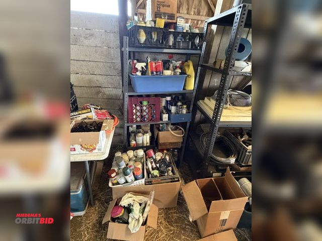 Lot 1-8509 - Rack with contents, includes assorted sprays, oils, cleaners, and much more.