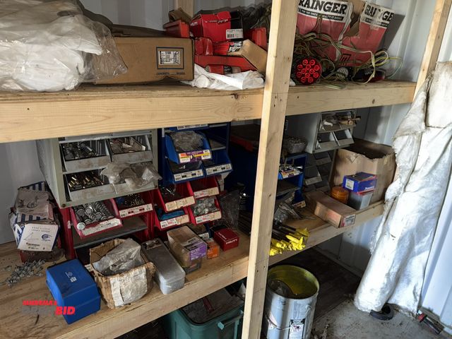 Lot 1-2987 - Large lot of assorted hardware, includes nuts, bolts, screws, anchors, small parts bins, Hilti screw...