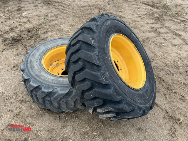 Lot 1-2998 - Set of Michelin size 300/70R16.5 IND all terrain skid steer tires with 8-lug rims.