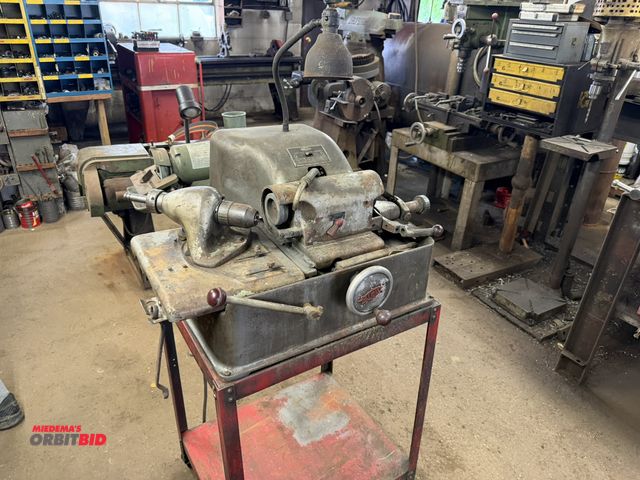 Lot 1-18568 - (1) Sioux valve face grinding machine, with metal table, 110V, believed to be in working condition.