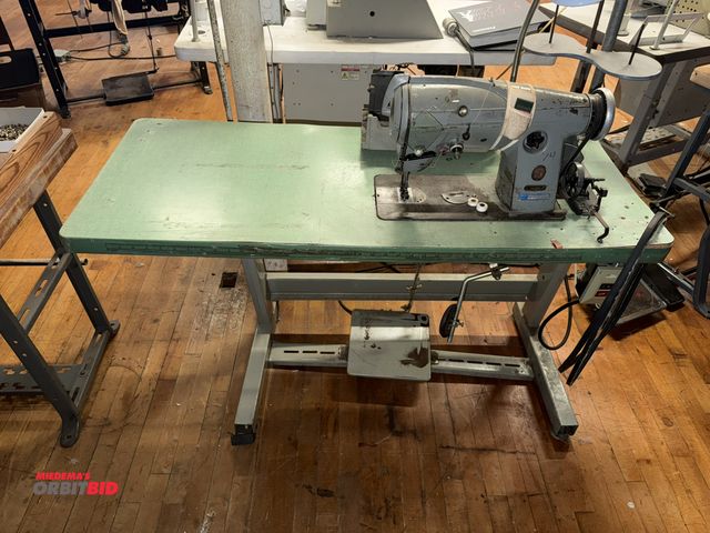Lot 1-4651 - (1) Singer, model 457G1, sewing machine with power table, S/N 0009, Singer 1/2 HP, 210/230, 3 phase ...