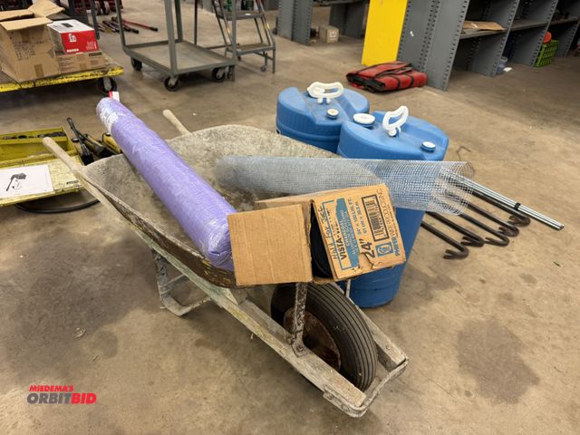 Lot 1-6311 - (2) 15 gallon plastic barrels, (1) single wheel wheelbarrow, (1) 4' x 6' plastic grass roll, and (1)...