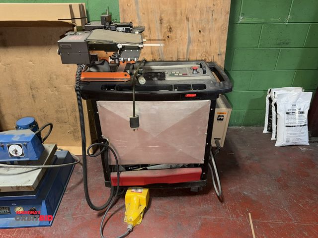 Lot 1-18740 - (1) Spartanics punch with automatic registration feed, foot pedal, 220V, single phase, mounted on Ru...