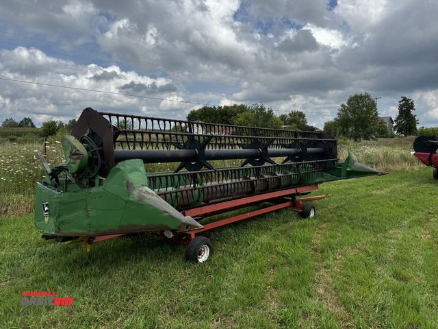 Lot 1-19741 - (1) John Deere 925 grain head, 25' wide, head is missing drive gears, S/N H00925F636366, head is in ...