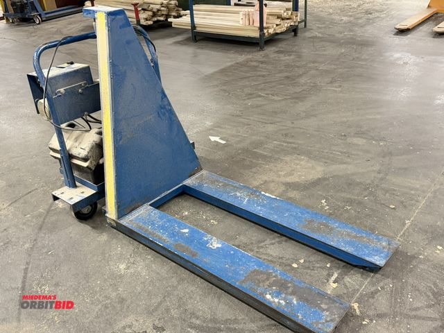 Lot 1-16914 - (1) Vestil 2500 lb. electric over hydraulic pallet jack, 49" x 8" wide forks, 27" from outside to ou...