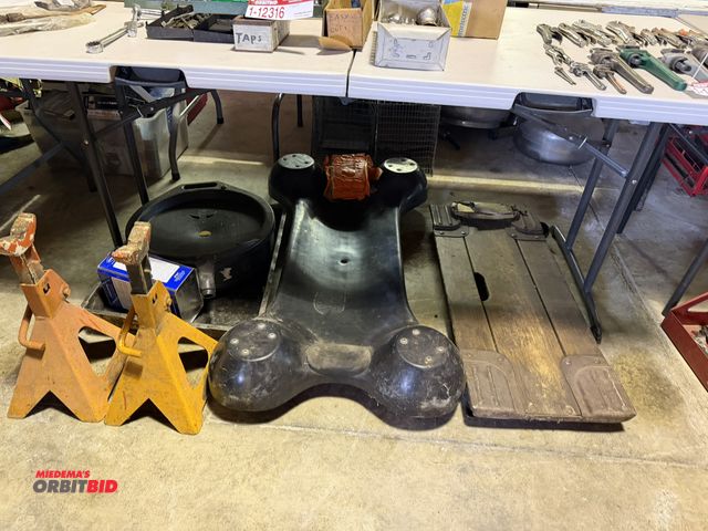 Lot 1-12318 - Lot of (2) garage creepers, (2) heavy duty jack stands, and oil drain bucket.