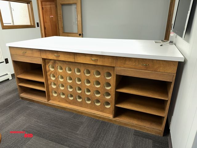 Lot 1-17808 - (1) 8' long x 40" tall x 48" deep wood cabinet with Formica top, 8 drawers, lower shelves, and bluep...