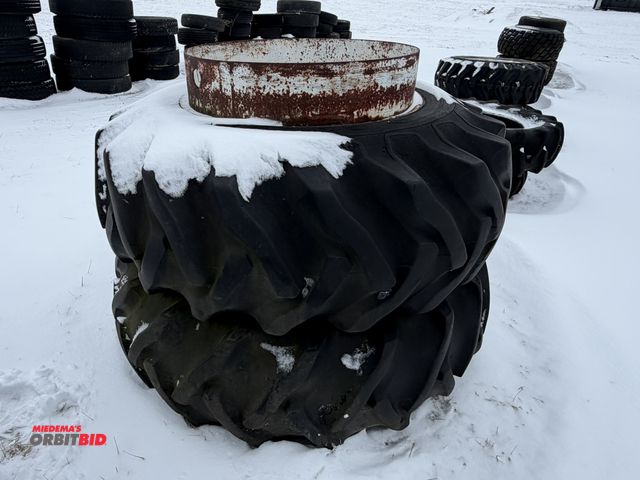 Lot 1-11639 - (1) set of clamp on duals with 18.4-30 tires, tires are cracked and weather checked.