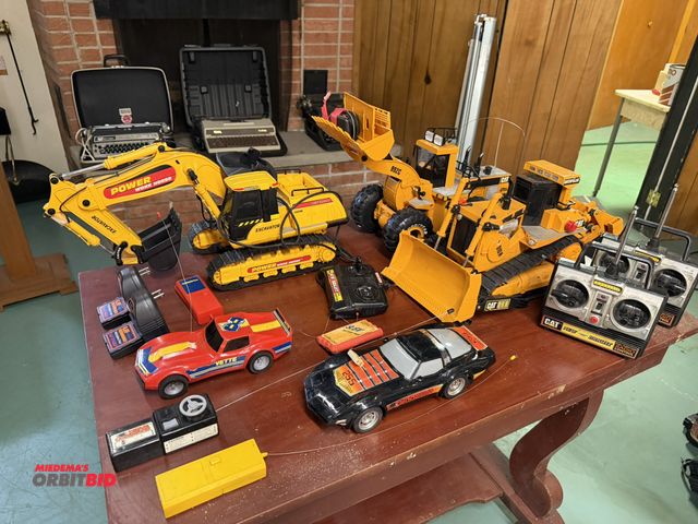 Lot 1-12185 - Large lot of assorted remote control items, includes (1) Cat D10N remote control, Dozer, Cat 992C wh...