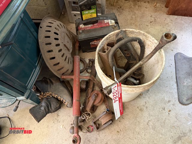 Lot 1-3284 - Lot of trailer hitches, trailer seat, pulleys, 3PT arm, and vintage plates