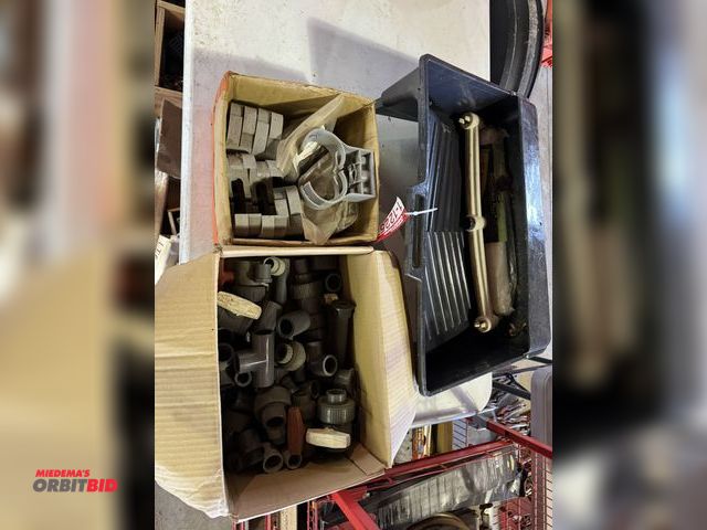 Lot 1-12257 - Large lot of assorted PVC fittings, T's, handles, paint bucket, and more.