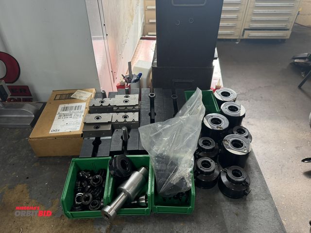 Lot 1-12359 - Large lot of assorted WOW Tooling, includes forks, (4) 12" x 3" x 3" plate adapters, various round p...