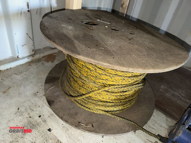 Lot 1-2986 - (1) partial spool of braided pole style rope, yellow with blue stripe, approx. 1/4" diameter, spool ...