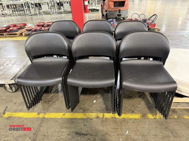 Lot 1-5256 - Lot of approx. (38) stackable chairs with plastic seats and backs and steel frames.