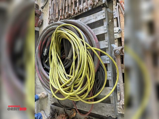 Lot 1-1412 - Skid of assorted air hose, includes 3/8" up to approx. 1.5" diameter, various lengths.