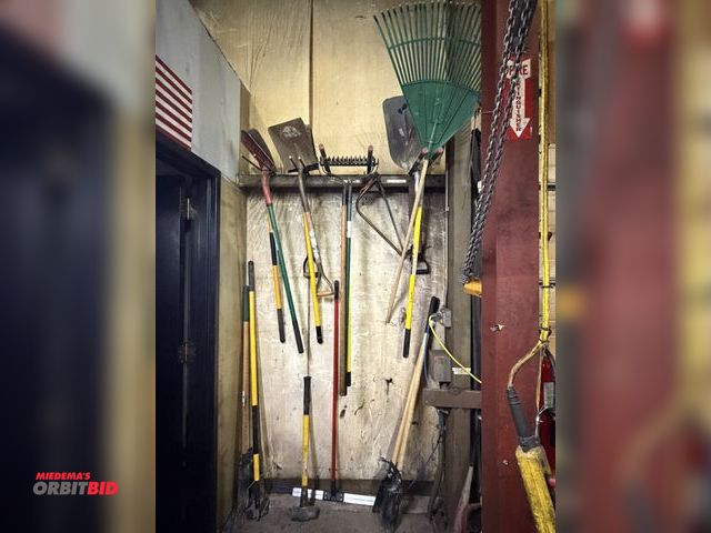 Lot 1-18724 - Lot of assorted lawn tools, including (2) sets of post hole diggers, spade and flat shovels, steel r...