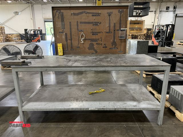 Lot 1-5399 - (1) 7' length x 37" height x 36" depth heavy duty steel work bench with custom made fork pockets on ...