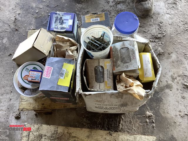 Lot 1-19064 - Lot of assorted fasteners which include nails, masonry nails, screws and more.