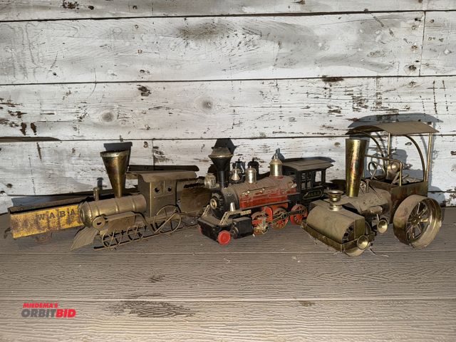 Lot 1-8338 - (1) vintage collectible tin steam roller music box (non-working), (1) vintage collectible tin train ...