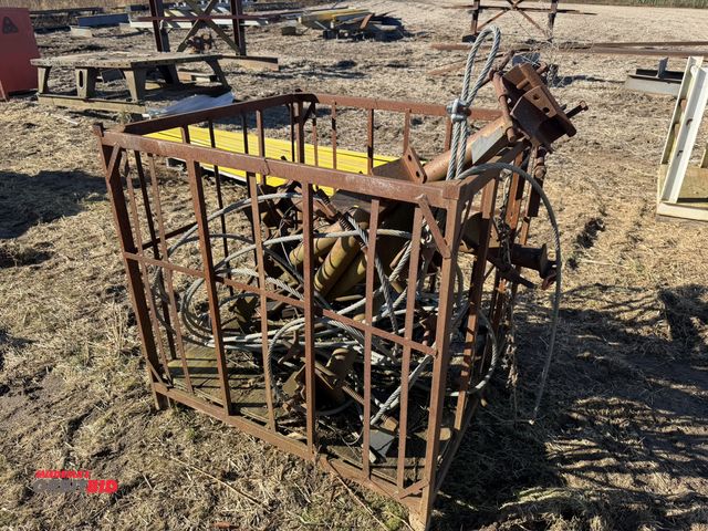 Lot 1-2928 - (1) steel crate full of assorted steel galvanized cable, and assorted railroad style hitches.