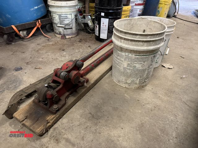 Lot 1-14220 - (1) rebar cutter, approx. 48" with (2) partial buckets of rebar.