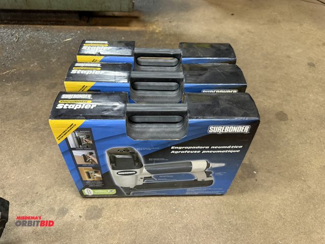Lot 1-12483 - Lot of (3) new Surebonder pneumatic staplers with cases.
