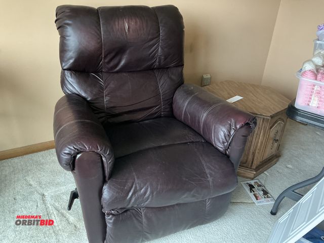 Lot 1-19188 - (1) leather manual reclining chair, (1) wood 24" side table, and (1) framed picture.