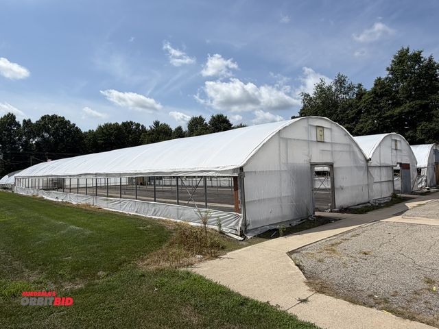 Lot 1-9979 - (1) 70' x 144' single gutter greenhouse, roof poly was replaced 1 year ago, manual crank up side wal...