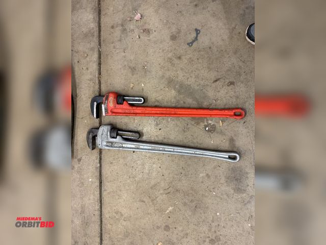 Lot 1-6338 - (1) Ridgid 36" aluminum pipe wrench, and (1) Ridgid 36" steel pipe wrench.