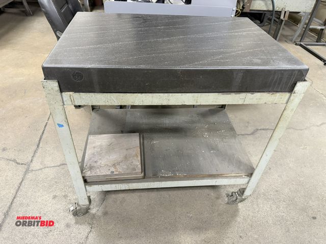 Lot 1-15315 - (1) black granite surface plate, 36" x 24" x 4" thick with heavy duty steel rolling base.