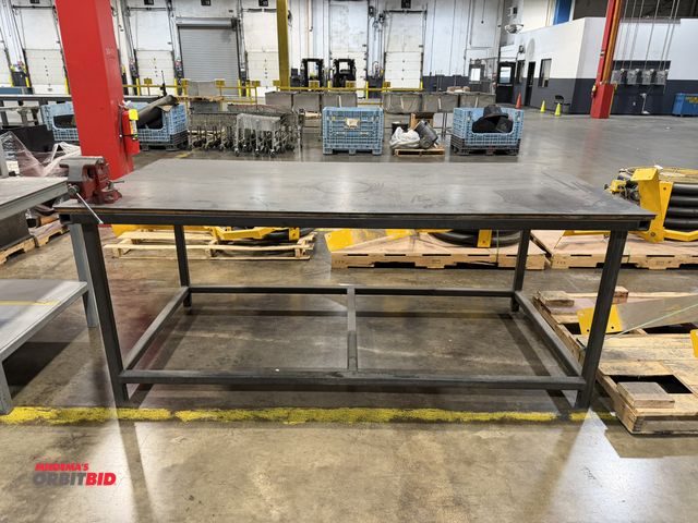 Lot 1-5131 - (1) 8' length x 39" height x 4' depth heavy duty steel work bench with steel top and 5.5" Wilton vic...