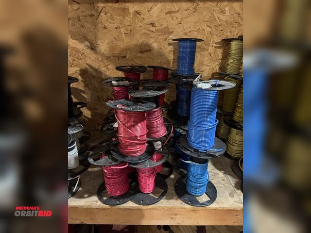 Lot 1-4518 - Lot of (23) partial spools of 10 gauge wire, red and blue.