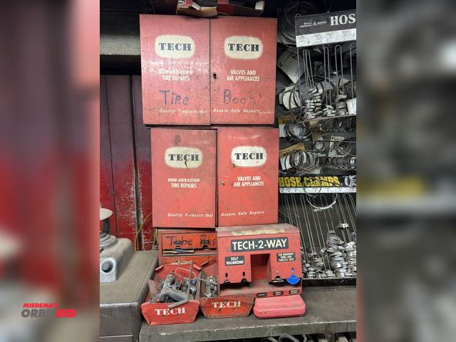 Lot 1-18565 - Lot of assorted tire repair supplies, includes vintage metal cabinets, approx. 21" wide x 10" deep x...