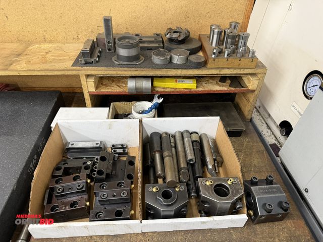 Lot 1-1709 - Lot of assorted CNC lathe tool holders and tooling, includes collets, face mill, and more.