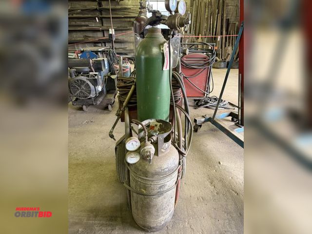 Lot 1-18127 - (1) oxygen/acetylene torch cart set up with approx. 20' of hose, built-in tool box, approx. 16" diam...