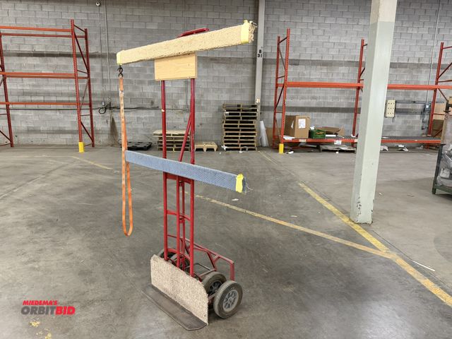 Lot 1-17374 - (1) approx. 74" tall glass dolly with 4 10" diameter solid rubber wheels, and 28" wide foot.