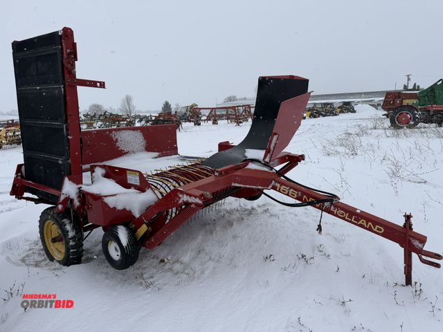 Lot 1-10411 - (1) New Holland 166, single row hay inverter, approx. 60" pickup head, 35" wide belt, S/N 977142, hy...