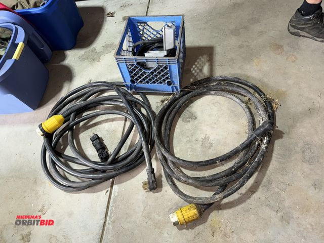 Lot 1-616 - Lot of (2) approx. 25' recreational trailer extension cords with assorted plug ends.