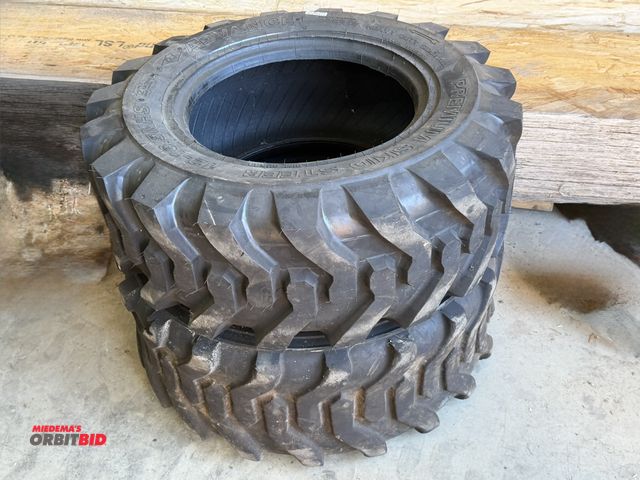Lot 1-1354 - Set of (3) premium skid steer tires, size 12-16.5NHS, 3rd tire not shown in photo.