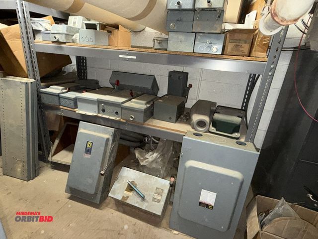 Lot 1-16730 - (1) 72" width x 60" height x 24" depth rivet lock shelving unit with assorted Square-D, Eaton, Westi...