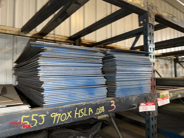 Lot 1-15091 - Lot of (8) racking sections of raw sheet steel  material, includes various types of metal marked by ...