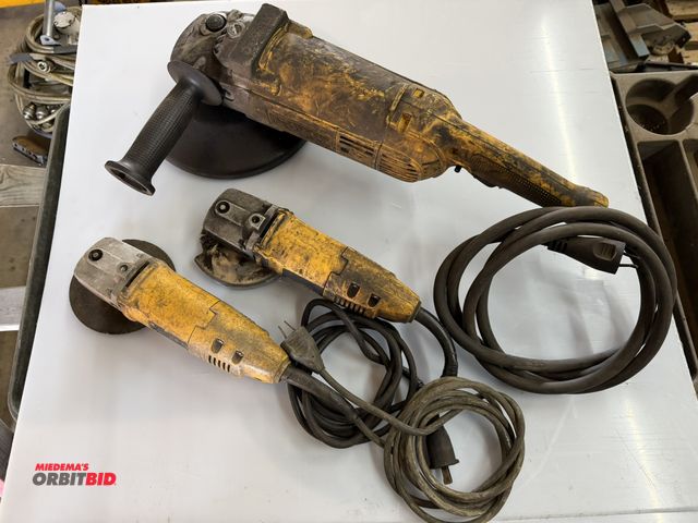 Lot 1-1306 - Set of DeWalt tools, includes (2) model DW402, 4.5" angle grinders, and (1) model DW28499, 9" right ...