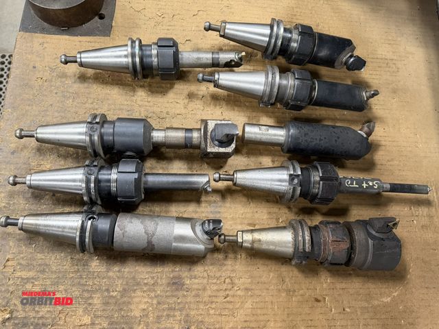 Lot 1-1919 - Lot of (9) various Cat 40 tool holders with cutting tools.